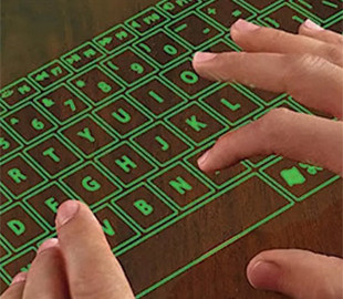 Apple запатентовала планшет будущего с проекцией клавиатуры на стол
