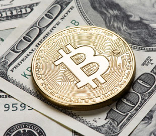 Чи варто купувати автомобілі Tesla за криптовалюту Bitcoin