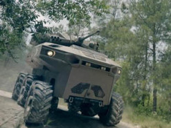 В Израиле представили боевого робота с беспилотниками и ракетами Spike на борту